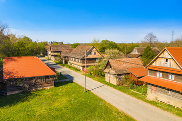 Fototapeta na wymiar Old houses in traditional village of Krapje, Lonjsko polje, Croatia
