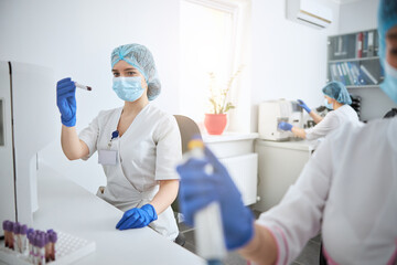 Female biochemist performing a complete blood count