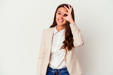 Young Indian business woman isolated on white background excited keeping ok gesture on eye.