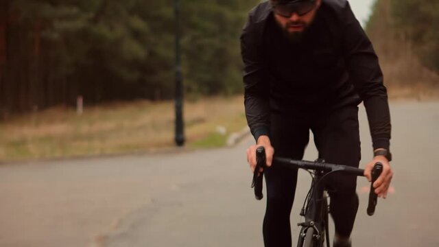 Cyclist Fitness Riding On Road Bike Ready For Triathlon Race.Hard Sport Workout.Triathlete Cyclist Training On Bicycle.Fit Athlete Sport Workout Training Cycling Triathlon Competition.Recreation Spor