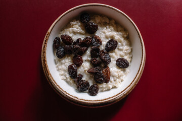 Rice porridge with raisins. Top view.