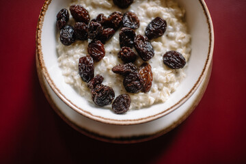 Rice porridge with raisins. Close up view.