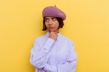Young mixed race woman wearing a beret isolated on yellow background suffers pain in throat due a virus or infection.