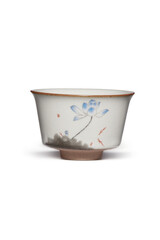 Subject shot of white ceramic bowl with crazing and decorated with picture of blue lotus flower painted in Chinese style. Graceful tea bowl is isolated on the white background.