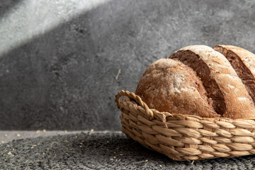 Bread in basket on marbled background