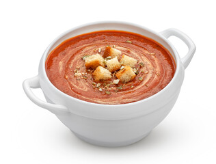 Bowl of tomato soup isolated on white background