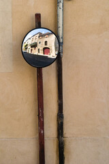 Convex mirror with old building