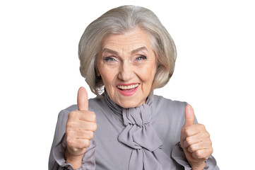 Portrait of happy senior woman showing  thumbs up