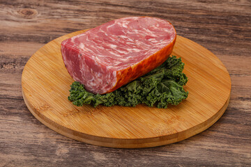 Beef ham piece over board