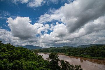 Fototapeta na wymiar The Mekong River stretches with beautiful sky mountain views.