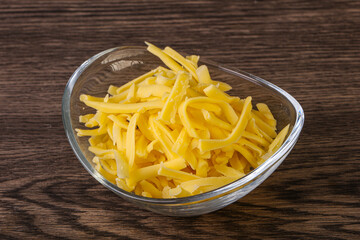 Shredded yellow cheese in the bowl