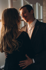 Couple in love. Close-up portrait of a man gently looks at his beloved woman