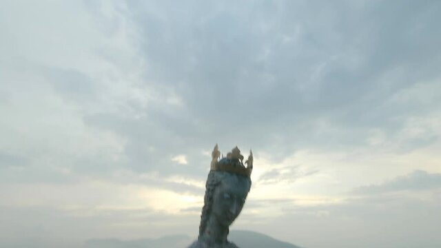 Statue of the Virgin Mary in the Styrian alps flying in and out by fpv drone