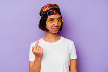 Young mixed race woman wearing a bandana isolated on purple background pointing with finger at you as if inviting come closer.