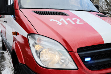 Number 112 on the red car. Common european and worldwide emergency number on the vehicle of the...