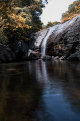 a small water fall with low shutter speed and with authum colours