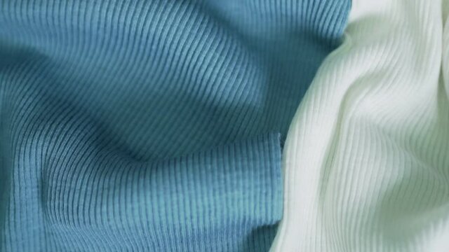 Fine Natural Wool Woven Fabric In Light Blue and White Colors, Wool Fabric Texture, Wool Woven Material Abstract Background. Textile Factory, Clothing Industry. Clothes, Cloth.