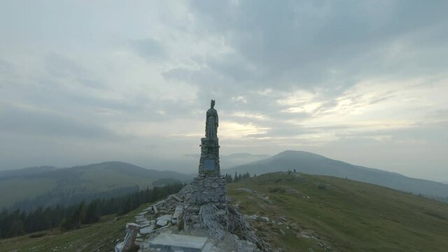 Statue of the Virgin Mary in the Styrian alps aerial view