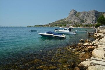 Fototapeta na wymiar Omis port in Split-Dalmatia County in Dalmatia, Croatia, with boats and ships