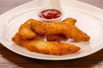 Fried chicken strips with sauce