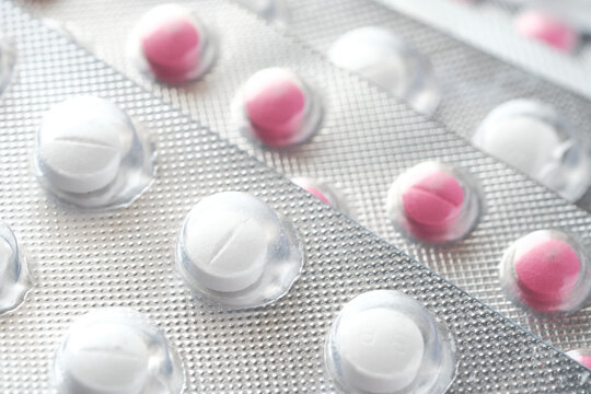 Close up of pills of blister pack on table 