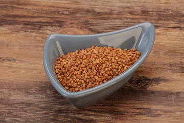 Raw buсkwheat cereal in the bowl