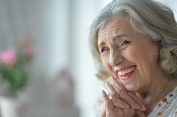 happy senior woman posing  at home