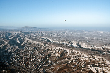 TURKEY, CAPPADOCIA, GOREME:  Aerial scenic view of hot air balloons flying over valleys of Göreme National Park