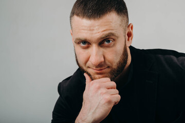 Portrait of handsome stylish man in elegant black suit