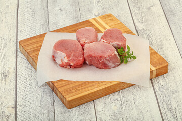 Raw pork medallion served rosemary