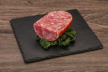 Beef ham piece over board