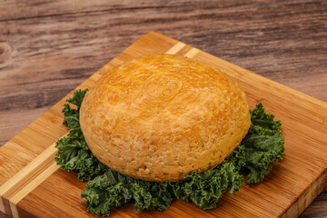 Smoked Georgian suluguni cheese piece