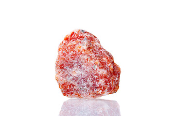 macro mineral stone orange calcite on a white background