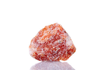 macro mineral stone orange calcite on a white background