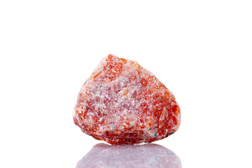 macro mineral stone orange calcite on a white background