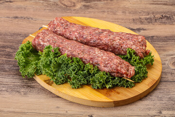 Raw minced beef kebab skewer