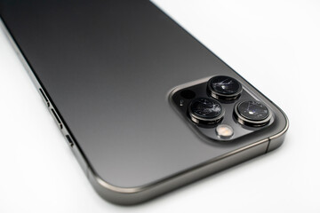 Broken lens on smartphone, isolated white background, back side, lens, camera