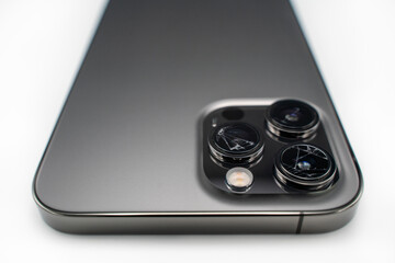 Broken lens on smartphone, isolated white background, back side, lens, camera