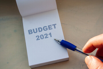 Budget 2021 word on white paper note and pen. Financial