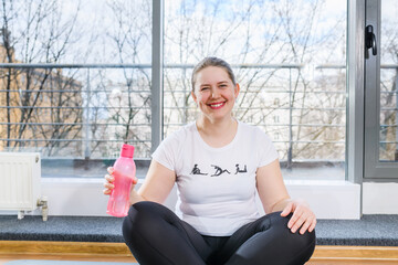 Portrait of smiling plus size sportive girl