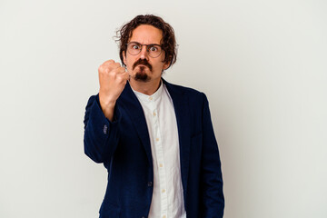 Young business man isolated on white background showing fist to camera, aggressive facial expression.