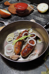 fried sausages with sauce