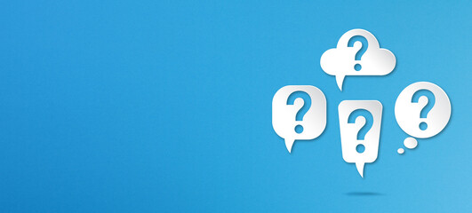 Question marks with speech bubbles on blue background	
