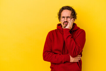 Obraz premium Young caucasian man isolated on yellow background who feels sad and pensive, looking at copy space.
