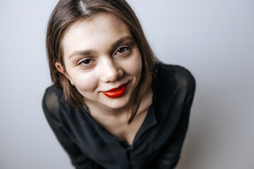 Large portrait of a girl with red lips and big eyes
