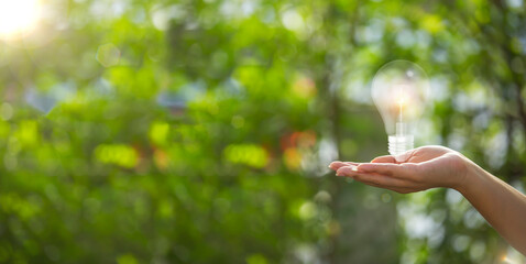 Technology, hand holding with environment Icons over the Network connection on green background.