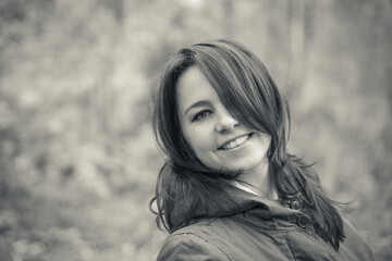 Beautiful girl on a forest background in black and white photo