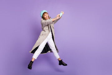 Photo of lady jump hold telephone open mouth take selfie wear blue beret coat pants boots isolated...