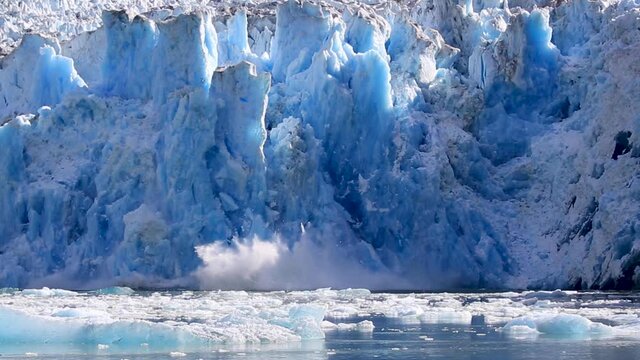 Hubbard Glacier Calving. Located in eastern Alaska near Juneau showing the amazing blue colours as the ice falls.
