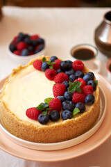Cheesecake with berries on a white background. Side view.